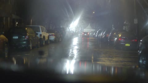 A person driving in the rain