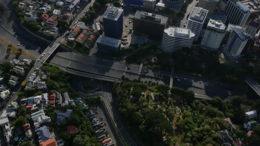 Cars travel along roads in an urban area
