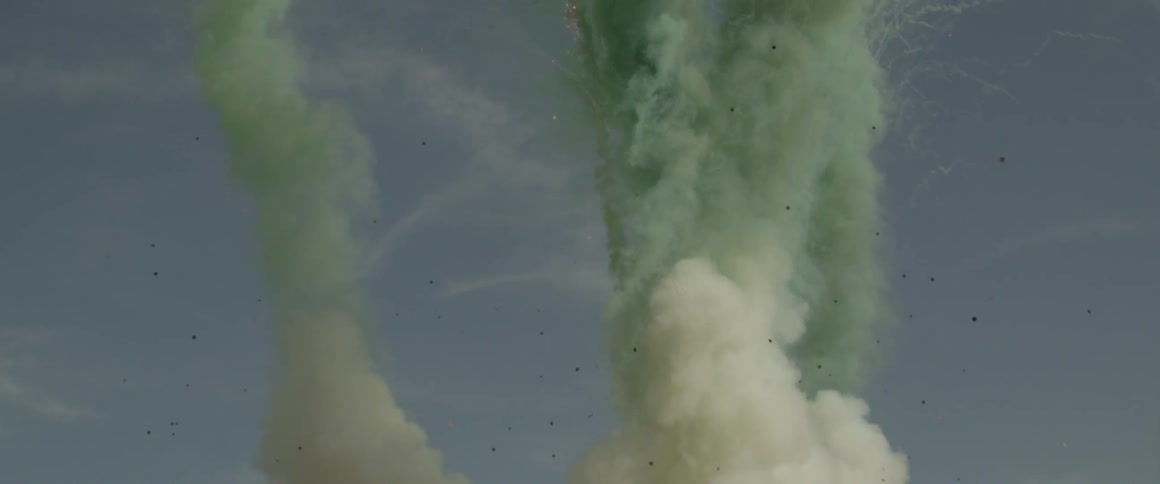 Many green flares soaring into the sky