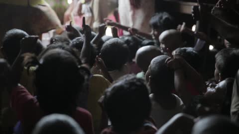 Children listen and respond to a woman talking