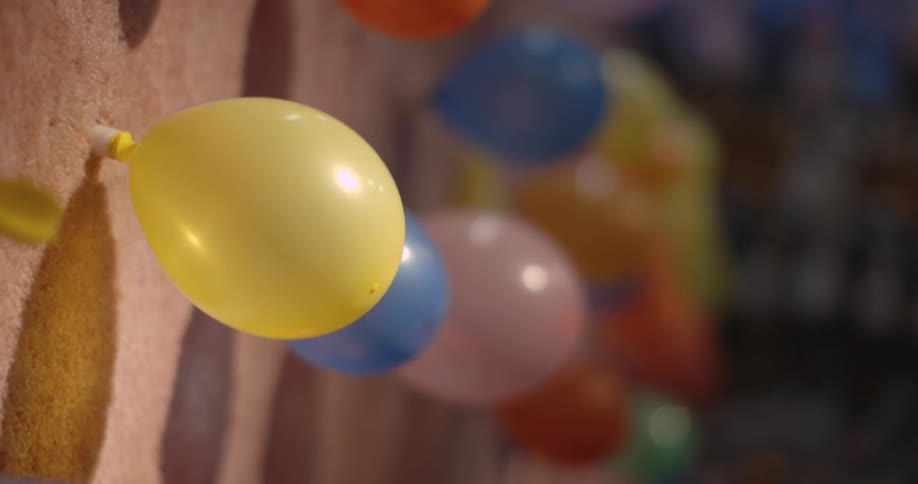 Balloons are popped with darts