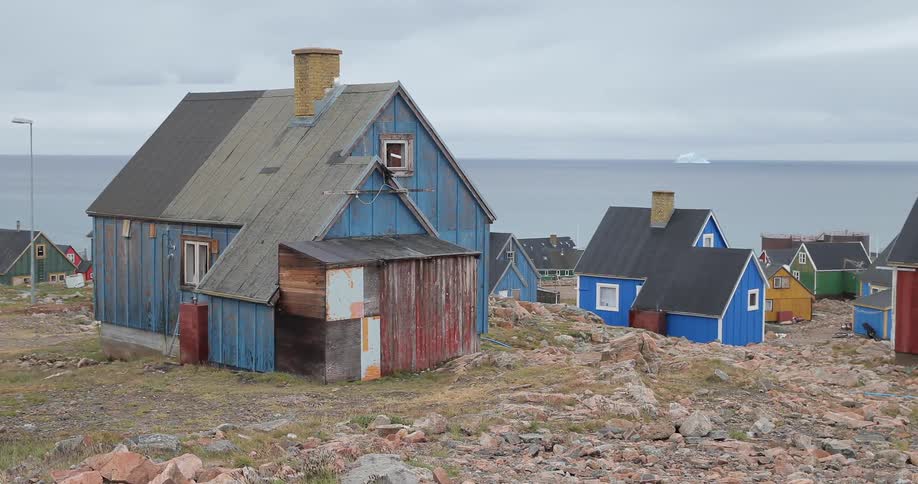Houses stand on a rocky coast