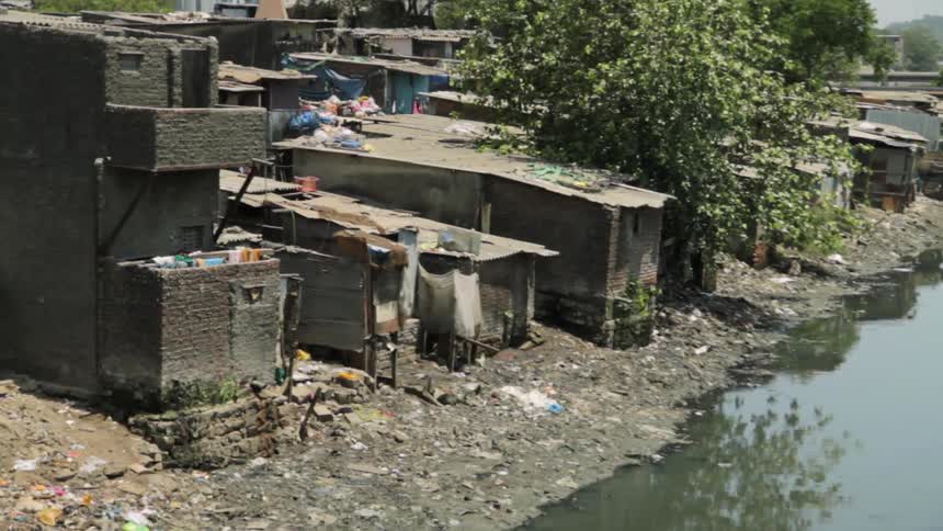 Cinder block homes on the edge of a river