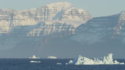 Large pieces of ice sticking up in massive water