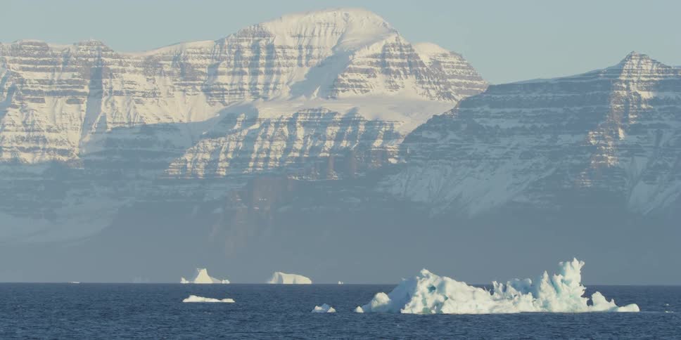 Large pieces of ice sticking up in massive water