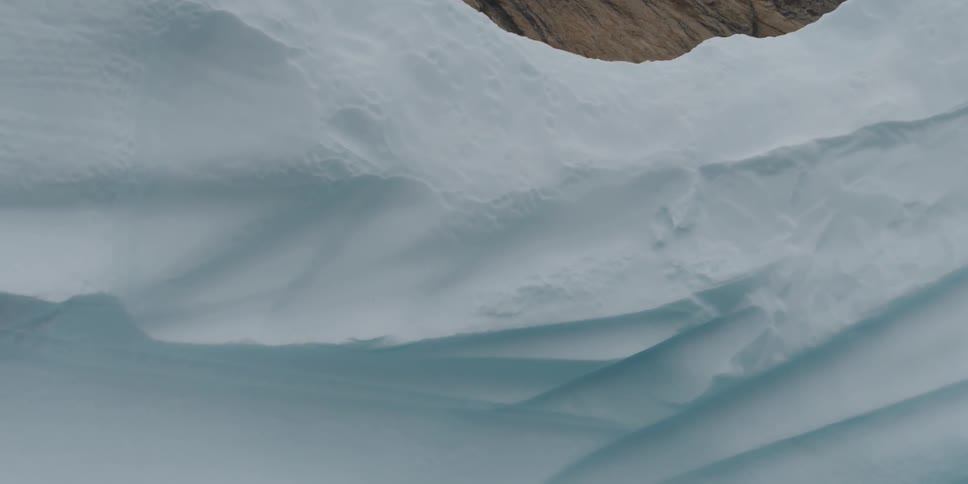 A glacier seen during the day, sailing on the water