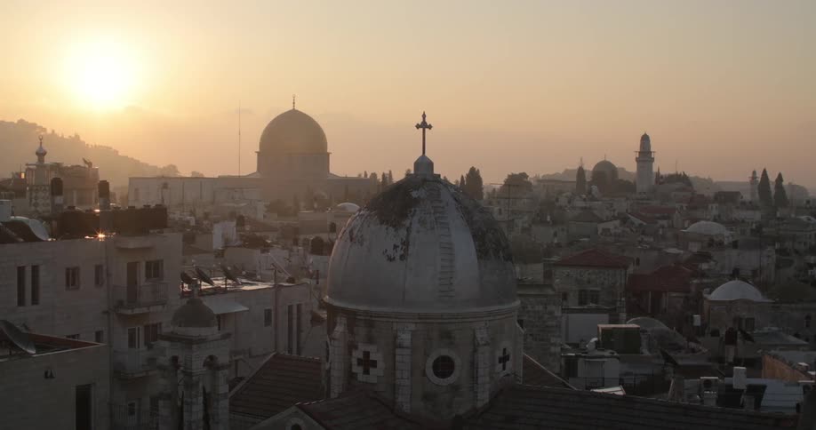 A church with buildings in the background