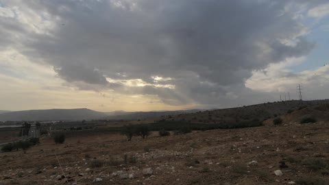 Clouds float over a desert