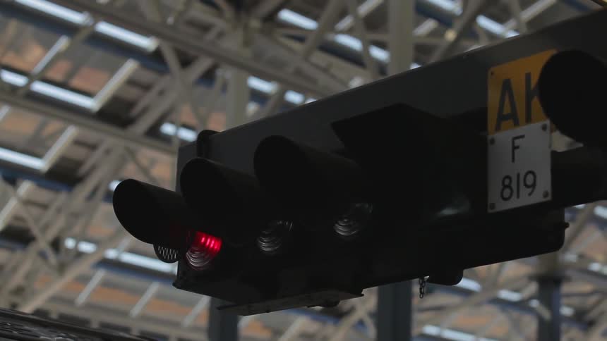 A traffic light with it currently shining red