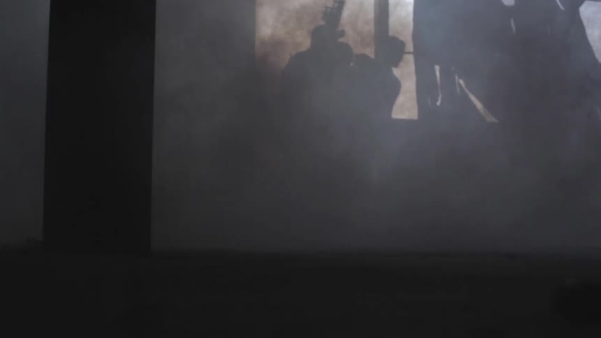 A swat team entering a building