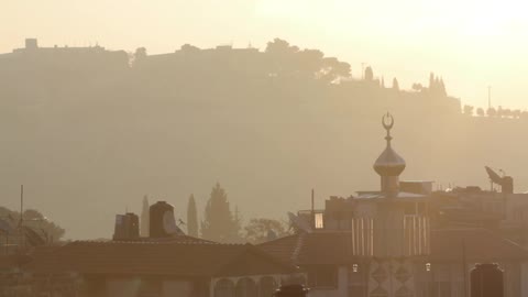 The sun shines over a city