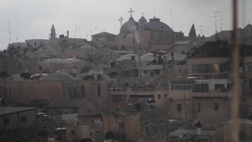 View of a town with many homes on a cloudy day