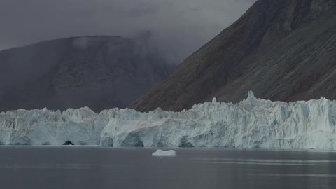 Glaciers float in front of mountains