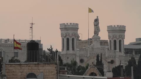 Flags waving over majestic buildings