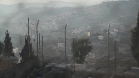 View of a city from behind the fence