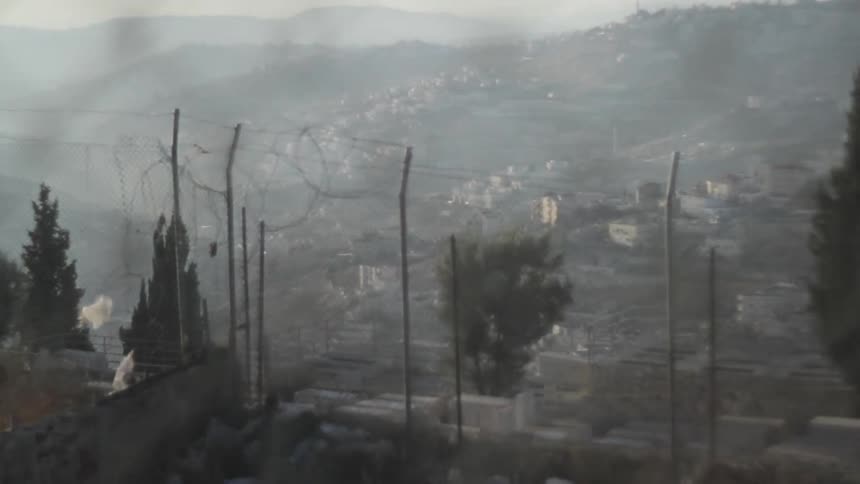 View of a city from behind the fence