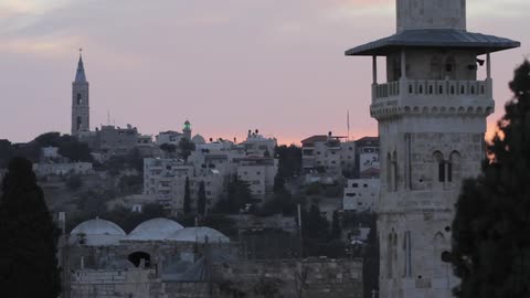 Crowded city with many stacked houses going up a hill