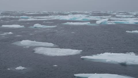 An icy ocean with glaciers and water
