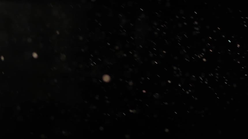 Light snow flurries in darkness