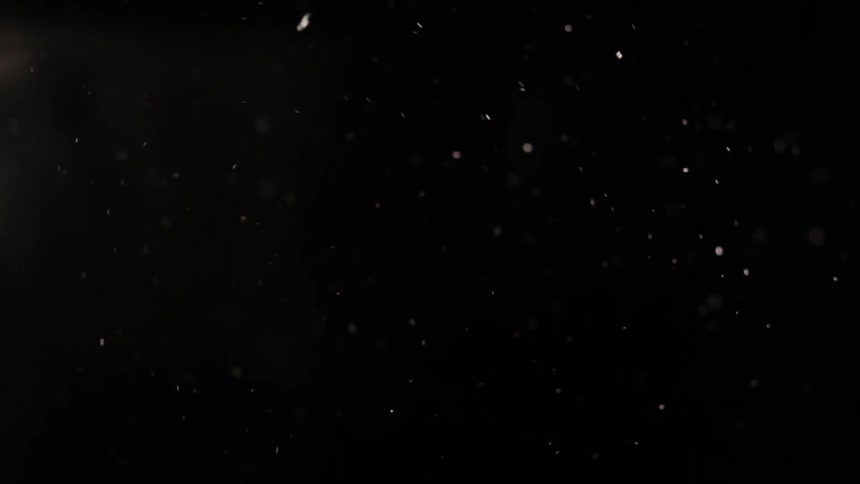 Fire embers floating in the darkness