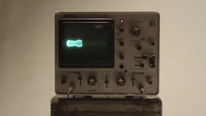 A monitor shows a frantic pattern
