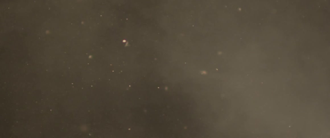 Debris and dust fly through the air