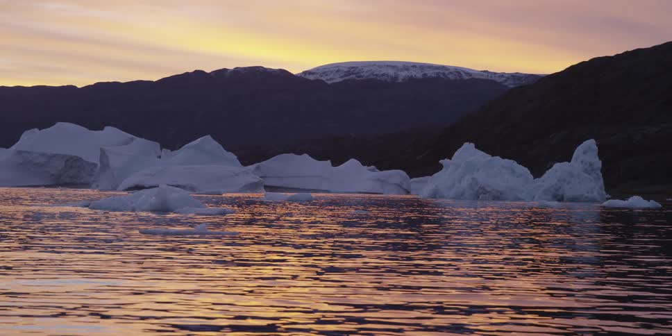 Glaciers float in a body of water