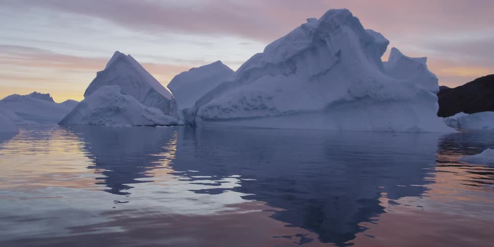 Icebergs are floating in cold flowing water