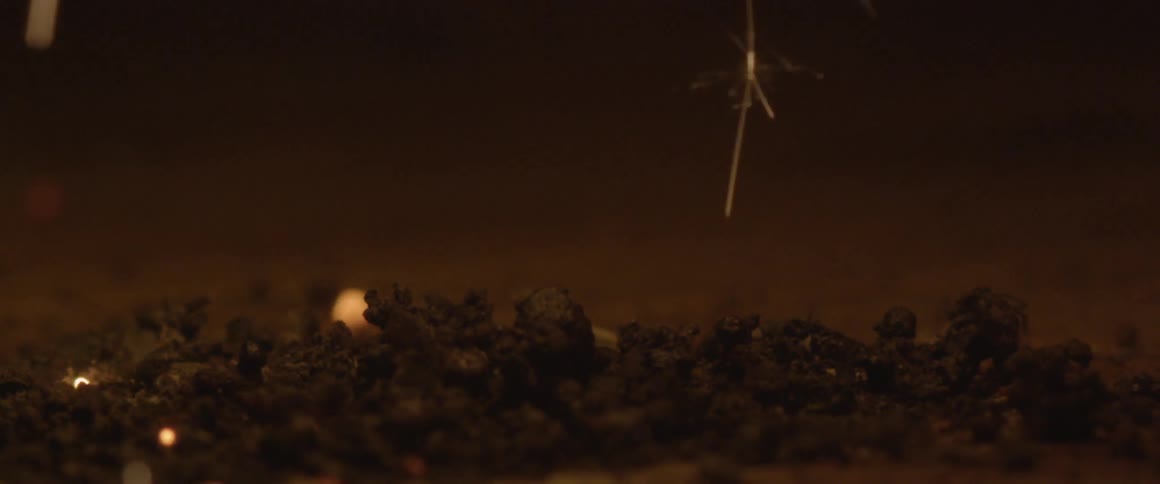 Sparks hit the ground in the dark