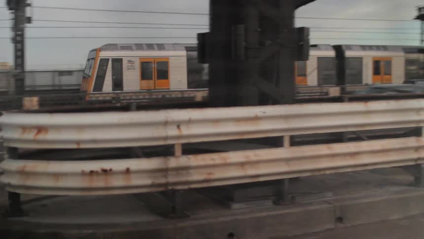 A train passing by a highway