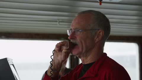 A man talks into a radio