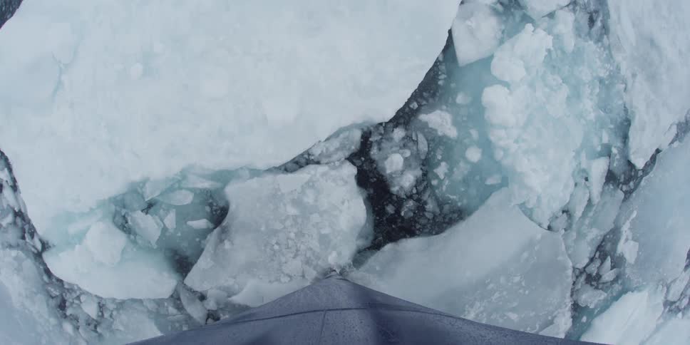 A structure makes it way through small blocks of frozen ocean