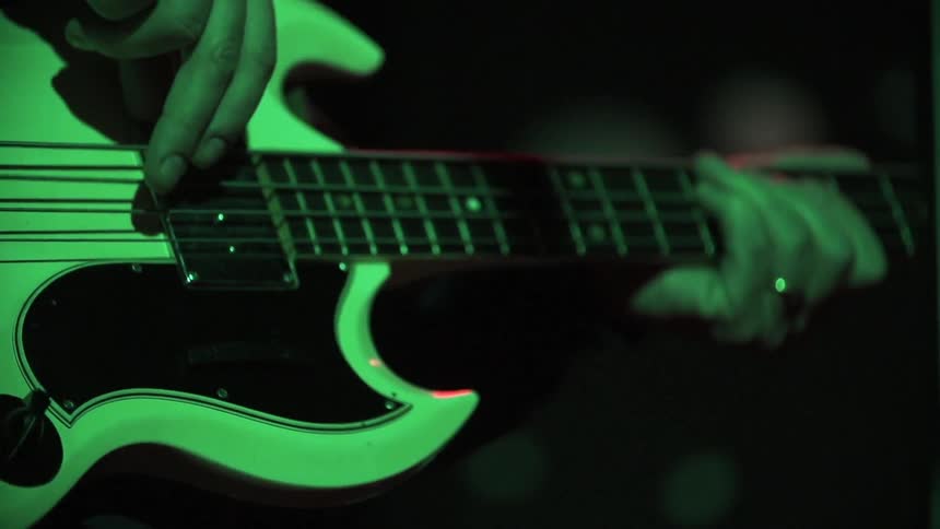 A person is playing the guitar