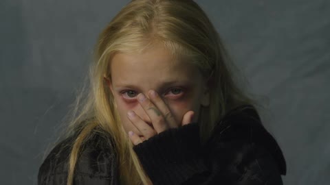 Little girl with tears in her eyes