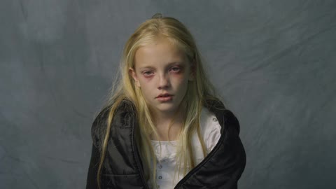 A blonde girl has her picture taken
