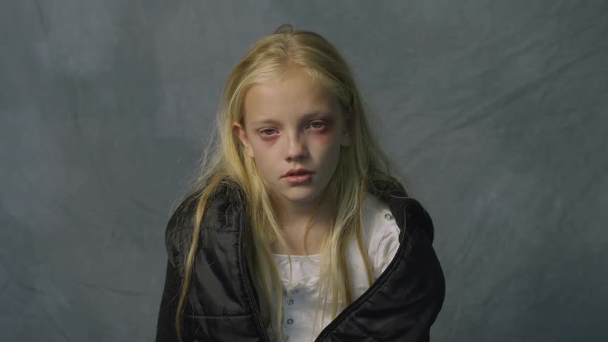 A blonde girl has her picture taken