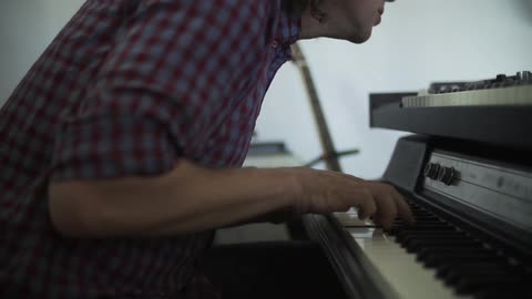 A man plays piano