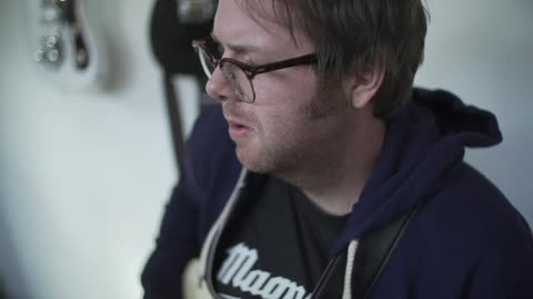 A man plays the guitar