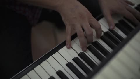 A person plays keyboard