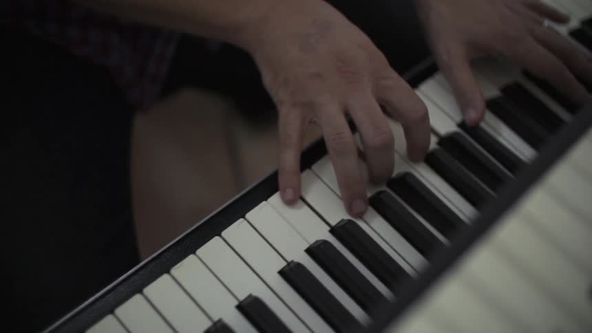 A person plays keyboard