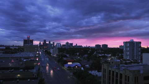 Aerial view of the city highway and tall buildings at dusk