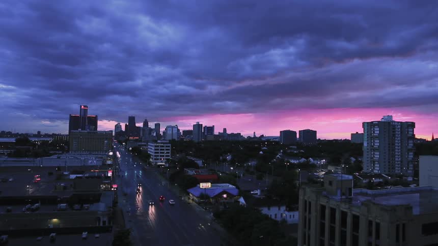 Aerial view of the city highway and tall buildings at dusk