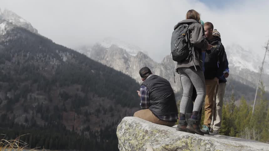 A group of hikers look towards the mountains