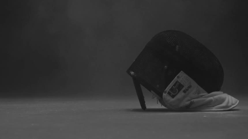 Fencers mask being dropped onto the floor