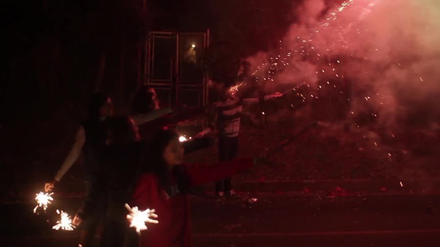People shooting off roman candles
