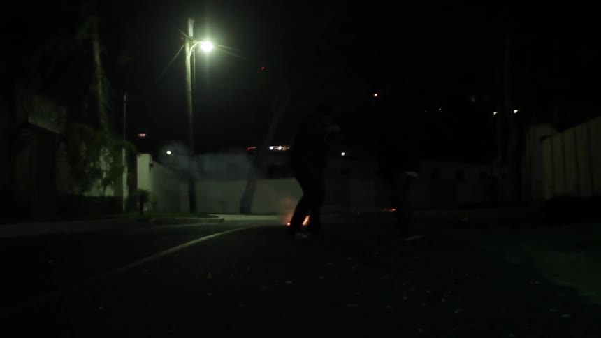 People putting out a small fire with their feet