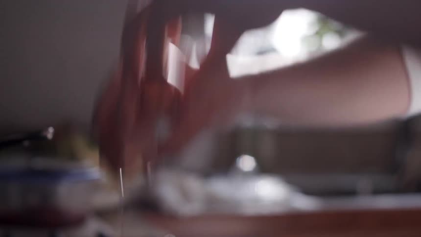 A person breaking an egg