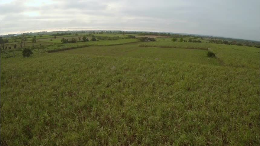 An aerial view of fields on a cloudy day