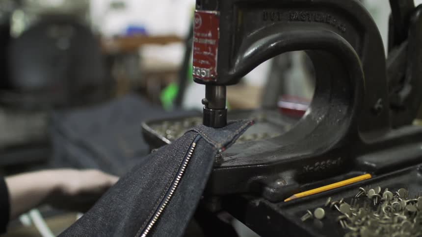 A person using a sewing machine