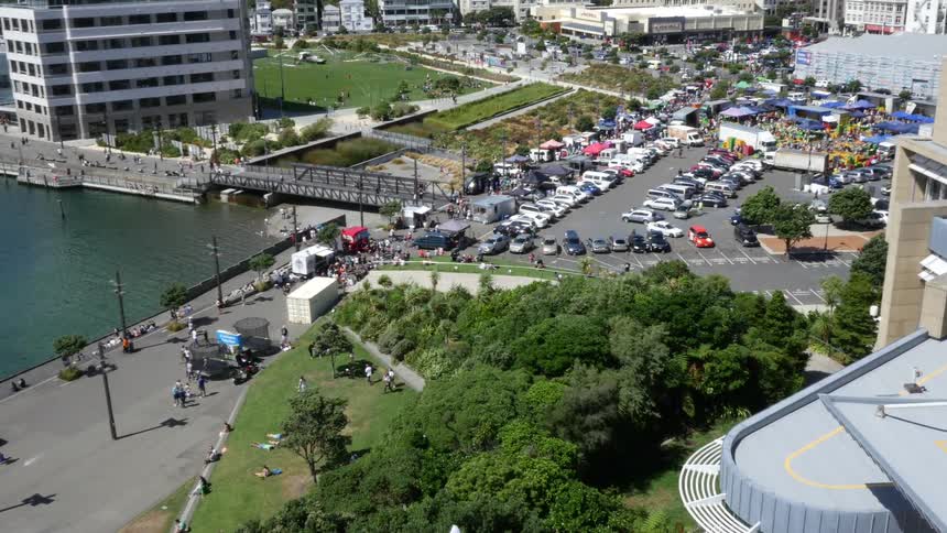 People enjoying the park in a busy city